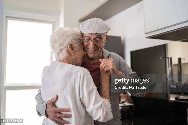 senior couple dancing at home - free pictures ballroom dancing stock pictures, royalty-free photos & images