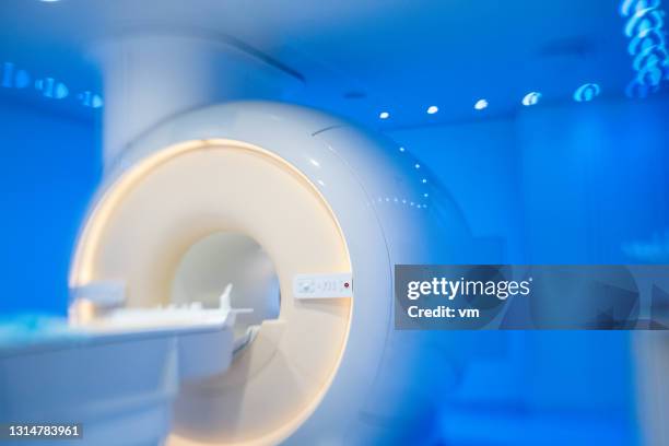 atmospheric photo of modern mri scanning room in hospital. - cat scan machine stock pictures, royalty-free photos & images