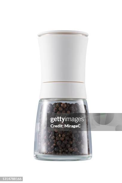 black peppercorn mill and shaker on solid white - pepper mill - fotografias e filmes do acervo