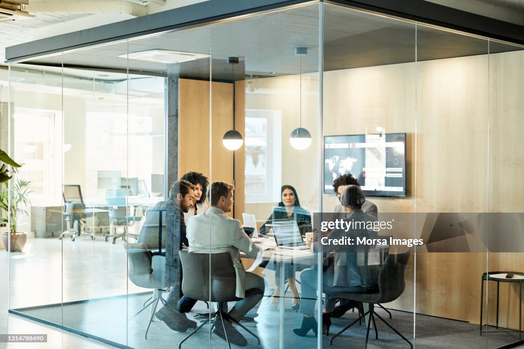 Business Colleagues Discussing Strategy At Office