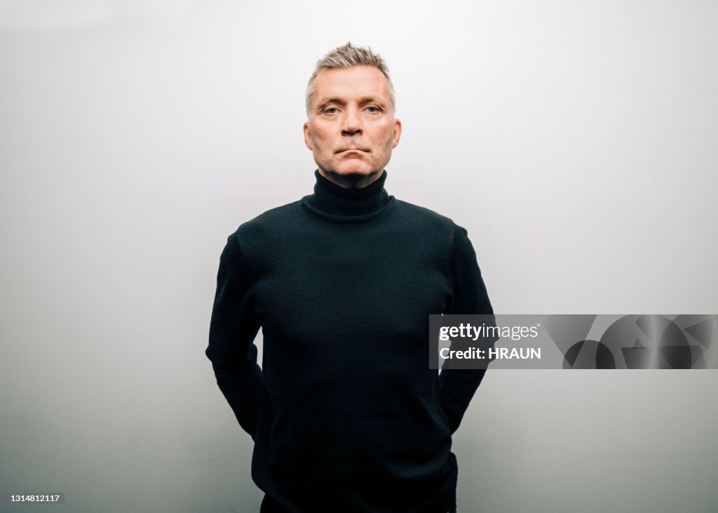 Man in turtle neck t-shirt