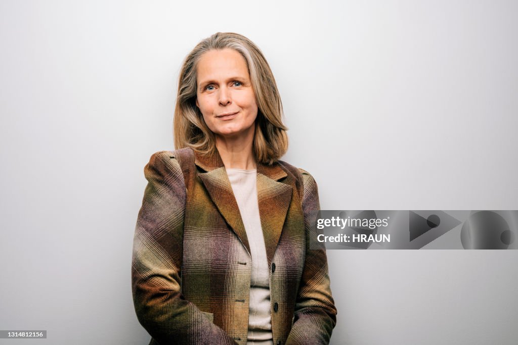 Woman in jacket on white background