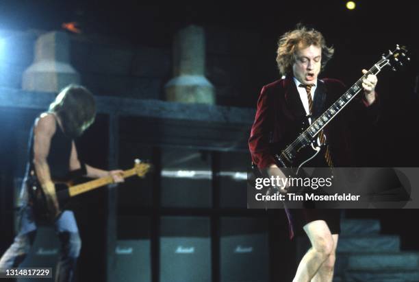 Malcolm Young and Angus Young of AC/DC perform at Shoreline Amphitheatre on August 15, 1996 in Mountain View, California.