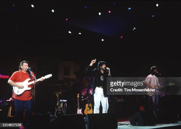 Jeff Cook, Randy Owen, and Teddy Gentry of Alabama perform at Shoreline Amphitheatre on August 9, 1996 in Mountain View, California.