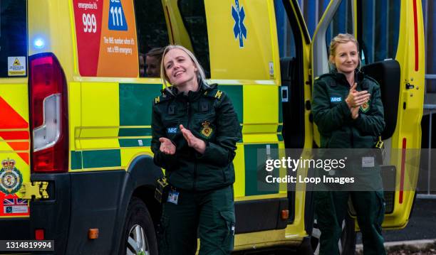 Two paramedics clapping outside Harrogate Hospital as they take part in Clap for our Carers.