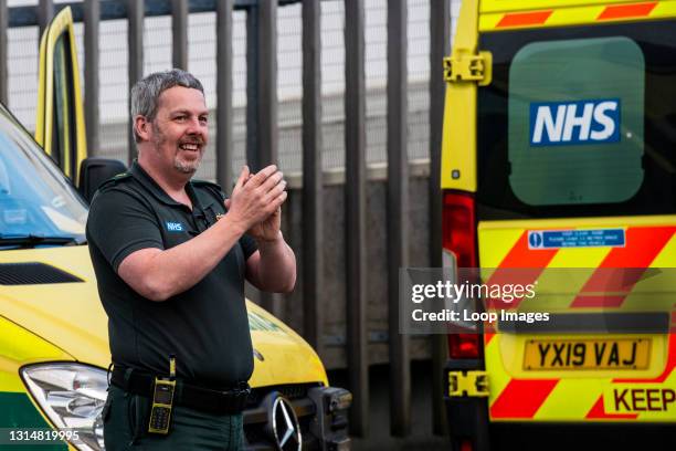 One paramedic clapping outside Harrogate Hospital as he takes part in Clap for our Carers.