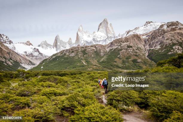 Hikers attempting to climb Fitz Roy mountain.