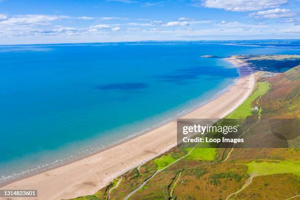 Aerial view of the longest beach in Rhossili Bay in Gower in Wales.