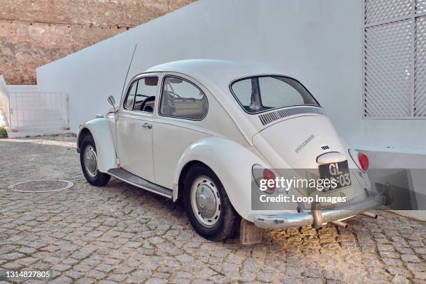 Old Volkswagen beetle on a cobbled street in Lagos in Portugal.