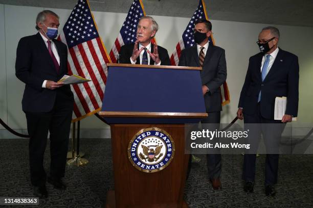 Sen. Angus King speaks as Sen. Ed Markey , Sen. Martin Heinrich and Senate Majority Leader Sen. Chuck Schumer listen during a news briefing after a...