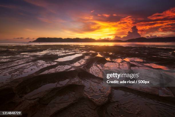 scenic view of sea against sky during sunset - ade rizal ストックフォトと画像