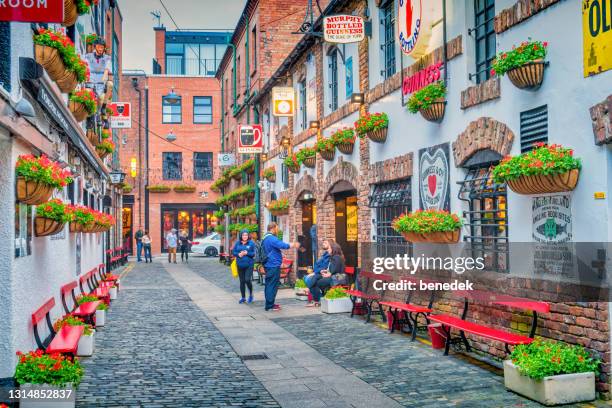 commercial court downtown belfast northern ireland duke of york bar - belfast ireland stock pictures, royalty-free photos & images