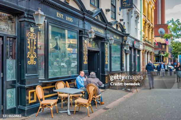 downtown belfast northern ireland uk bar restaurant patio - belfast stock pictures, royalty-free photos & images