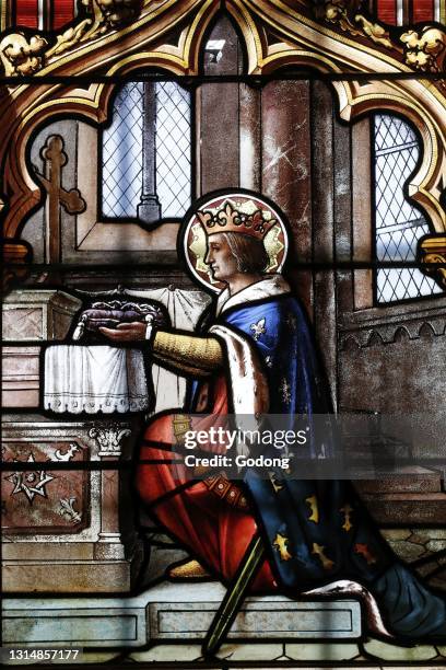 Saint Thomas of Cantorbery church. Stained glass window. King Saint Louis and the crown of thorns. Cuiseaux. France.