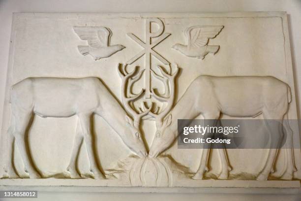 Orval trappist abbey, Belgium. Peace symbol relief.