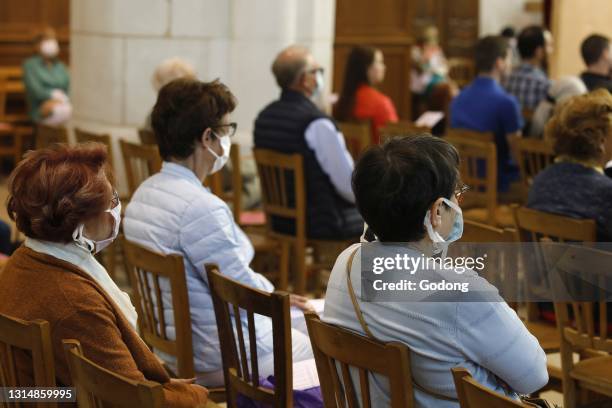 Pentecost mass in St Nicolas's church, Beaumont-le-Roger, France.