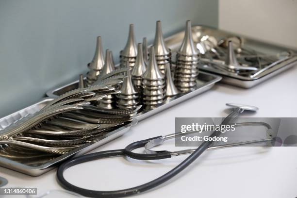 Medical instruments sitting on doctors desk. France.