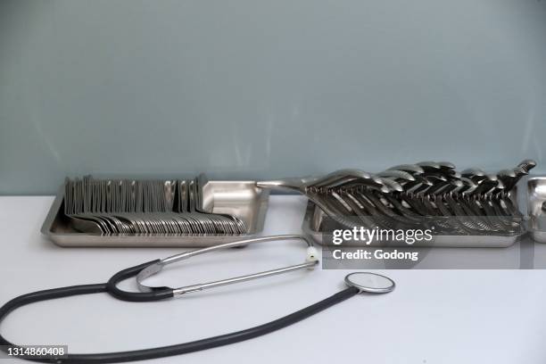 Medical instruments sitting on doctors desk. France.