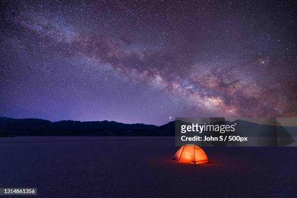 scenic view of illuminated tent against sky at night,inyo county,california,united states,usa - s the adventures of rin tin tin stockfoto's en -beelden