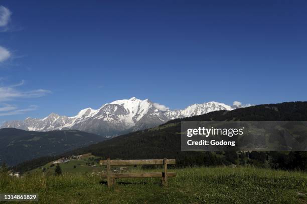 Wooden bench facing Mont Blanc massif. French Alps. France.