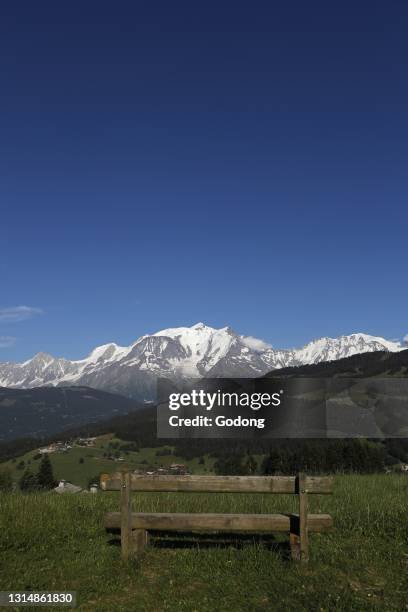 Wooden bench facing Mont Blanc massif. French Alps. France.