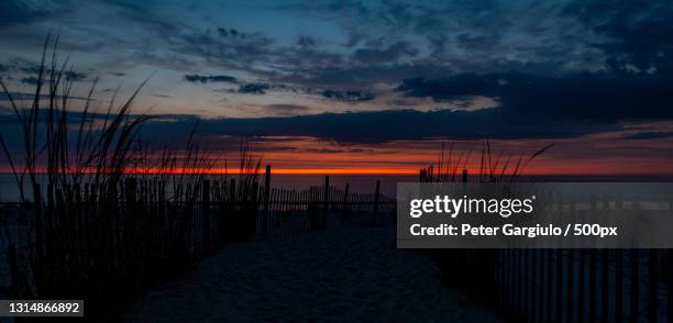 scenic view of sea against sky during sunset,dewey beach,delaware,united states,usa - dewey beach de stock pictures, royalty-free photos & images