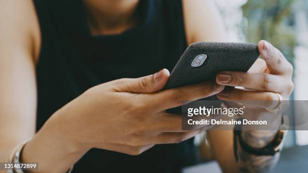closeup shot of an unrecognisable businesswoman using a cellphone in an office - text alert stock pictures, royalty-free photos & images