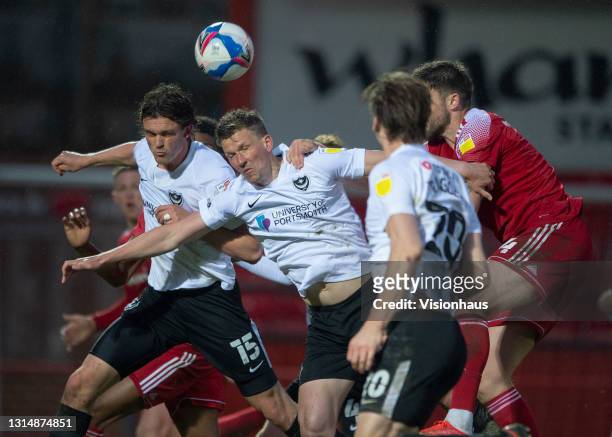 Cameron Burgess and Michael Nottingham of Accrington Stanley with Rasmus Nicolaisen, Sean Raggett and Paul Downing of Portsmouth in action during the...