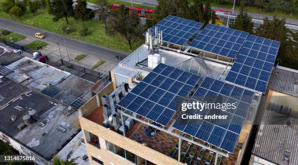 building using solar panels as their source of energy - self sufficiency stock pictures, royalty-free photos & images