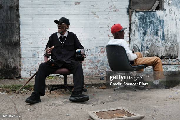 Men relax on the sidewalk this rural Delta community on April 27, 2021 in Greenville, Mississippi. So far, an estimated 23 percent of Mississippians...