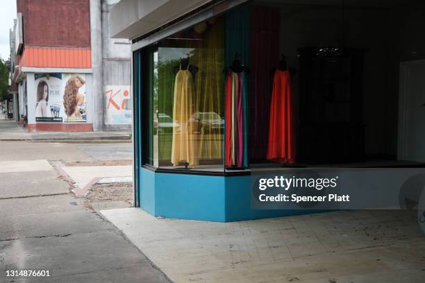 Dresses hang in a store window in this rural Delta community on April 27, 2021 in Greenville, Mississippi. So far, an estimated 23 percent of...