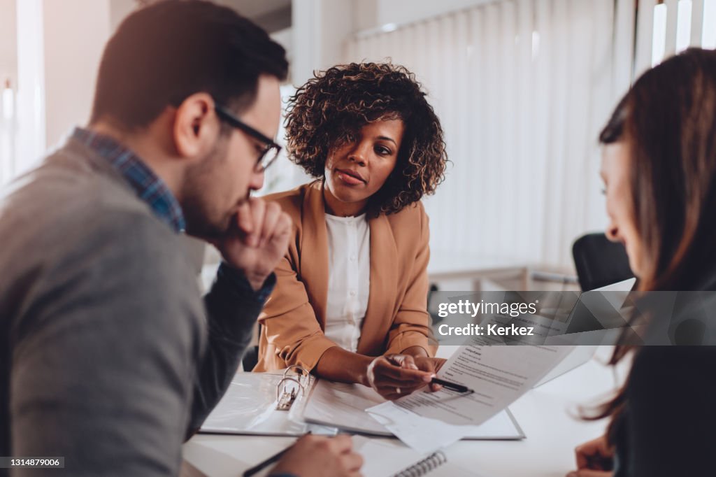 Couple preparing to sign a contract of sale