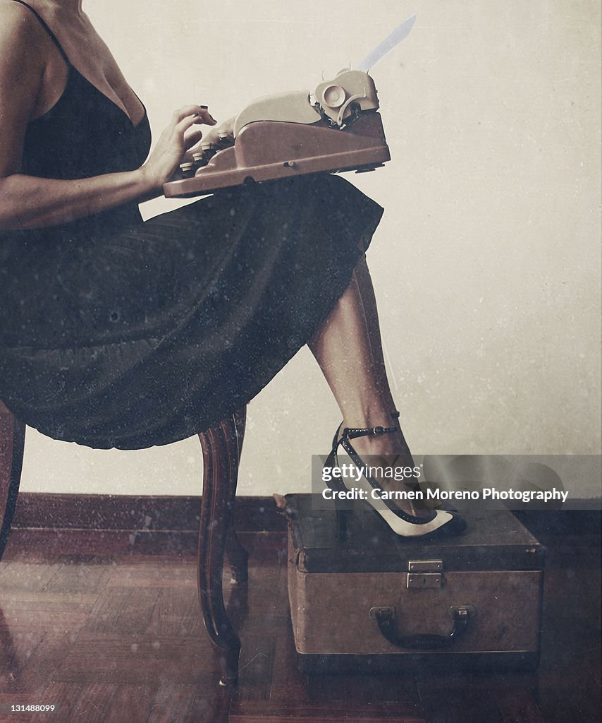Woman using typewriter