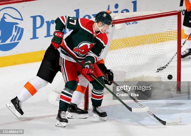 Yegor Sharangovich of the New Jersey Devils scores in the third period against the Philadelphia Flyers at Prudential Center on April 27, 2021 in...
