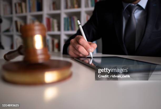 businessman signing digital contract on tablet using stylus pen - electronic document stock pictures, royalty-free photos & images