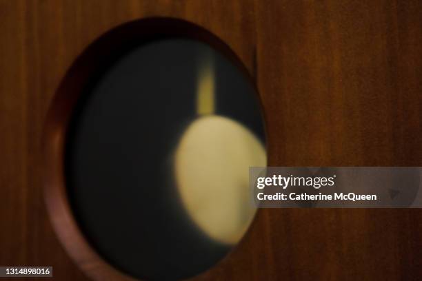 gold clock pendulum in motion - pendel stock-fotos und bilder