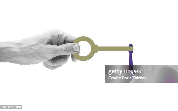 hand holding key. - key in door stock-fotos und bilder