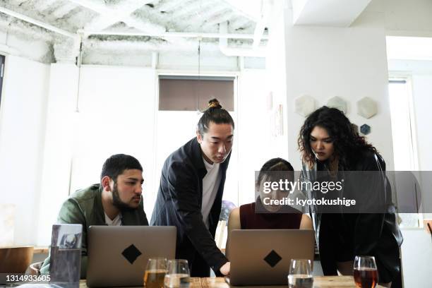 young entrepreneurs at coworking office and cafe in asia - college editor stock pictures, royalty-free photos & images