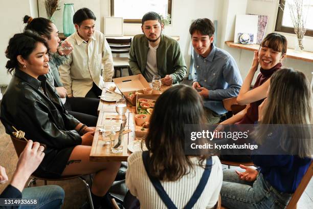 friends having home party with vegan food - issue celebration stock pictures, royalty-free photos & images