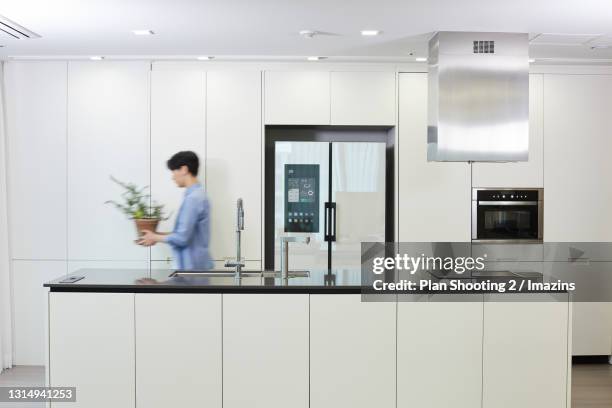 Man Using Kitchen Machine 574 Man Walking Into Kitchen Stock Photos, High-Res Pictures, and ...