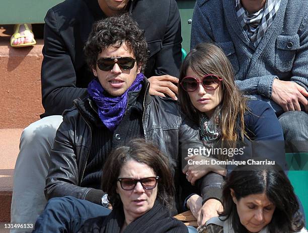 Marie Gillain and guest attend the French Open at Roland Garros on May 31, 2011 in Paris, France.