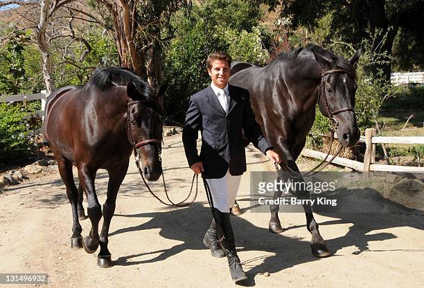 Elite Equestrian Rider Nick Haness poses with Horses Ned and Southern during a photo shoot on July 5, 2010 in Silverado, California.