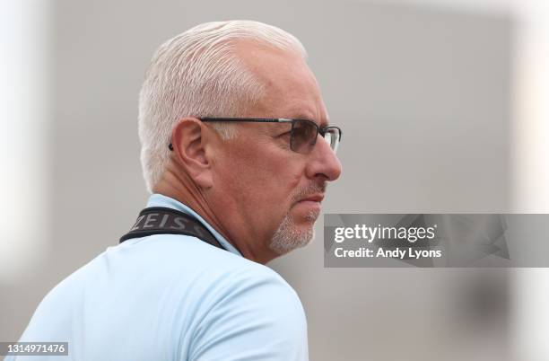 Todd Pletcher the trainer of Bourbonic, Dynamic One and Sainthood watches horses work during the training for the Kentucky Derby at Churchill Downs...