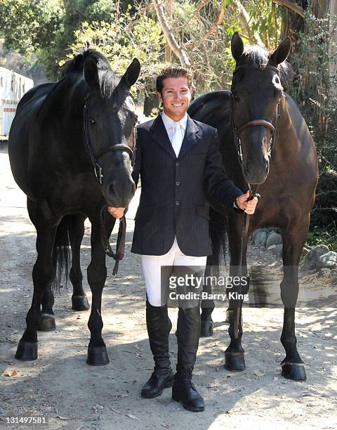 Elite Equestrian Rider Nick Haness poses with horses Ned and Southern during a photo shoot on July 5, 2010 in Silverado, California.