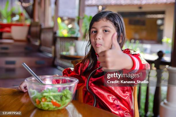 little girl give thumbs up for her salad - perfection salad stock pictures, royalty-free photos & images