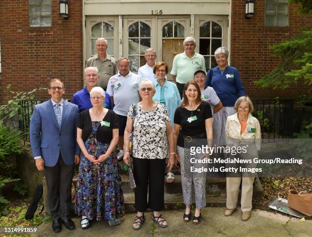 Reunion attendees gather for a photo, along with Stephen Mickulik, the Principal of La Salle Academy. During a reunion for the 1960 8th grade class...