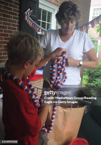 Wyomissing, PA 1313 Margaret McShane Pendergast, of Wyomissing gets out Fourth of July decorations with her grandson C. Patrick Pendergast of...