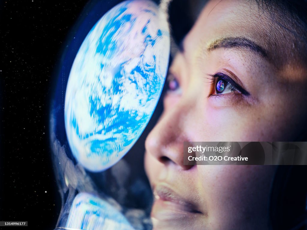 Woman in Space with Earth Reflection