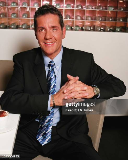 Television presenter Dale Winton photographed in a cafe, circa 2003.