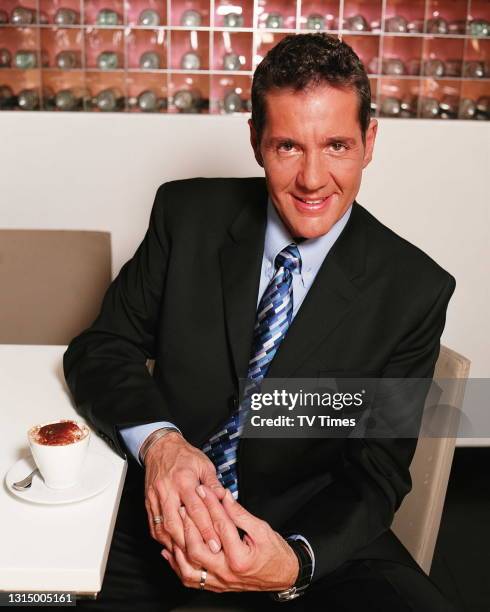 Television presenter Dale Winton photographed in a cafe, circa 2003.